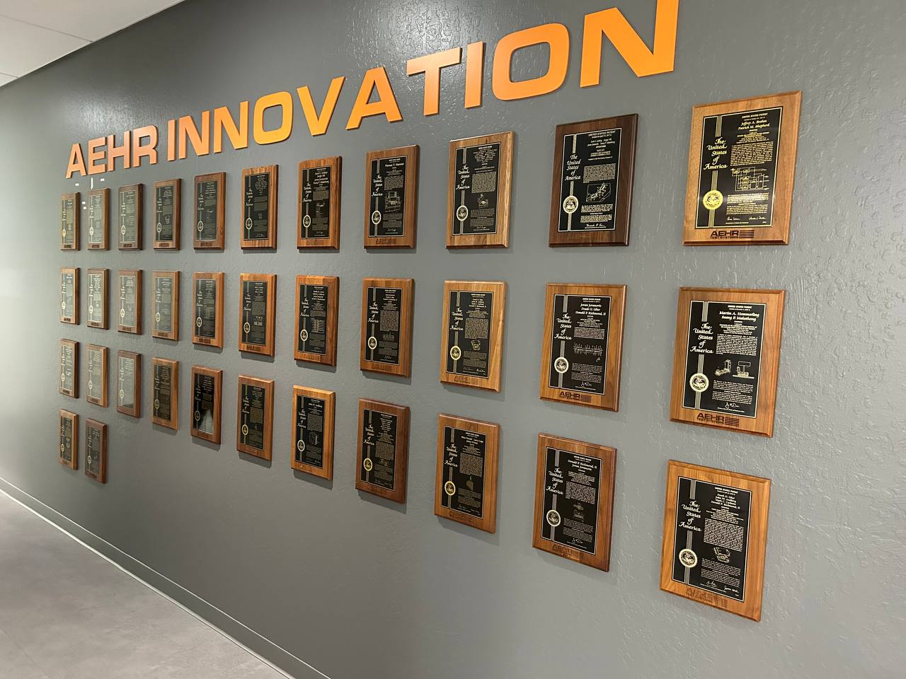 Completed patent award wall with dimensional office lettering
