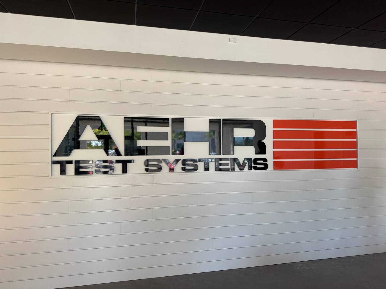 Large dimensional company sign on a reception wall
